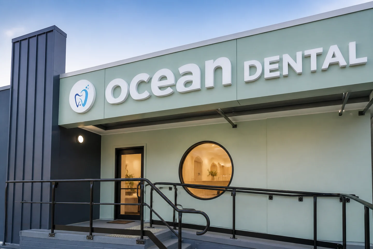 Ocean Dental exterior concept showing seafoam cladding, an accessible ramp and a circular window
