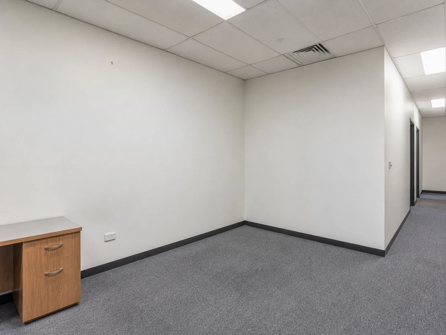 Synthetic visualisation of a plain office room before a proposed clinical conversion